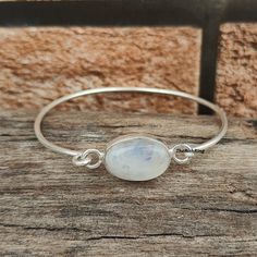 Welcome to my shop, Blue Fire Moonstone 925 Sterling Silver Bangle ,Open Adjustable Bangle ,Moonstone Jewelry ,Oval Shaped Moonstone Bangle ,Gift item. * Occasion : Anniversary, Engagement, Gift, Party, Wedding Stone Details * Stone Name: Moonstone  * Stone Colour : White  * Stone Shape : Oval  ♡ Thank You For Visiting :) Spiritual Moonstone Bangle Jewelry, Minimalist Oval Bangle As A Gift, Minimalist Oval Bangle As Gift, Minimalist Oval Bangle Gift, Spiritual Moonstone Bangle, Handmade Moonstone Bracelets, Sterling Silver Oval Bangle As Gift, Oval Sterling Silver Bangle For Gift, Silver Oval Bangle With Gemstone