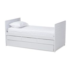 a white bed with two drawers underneath it