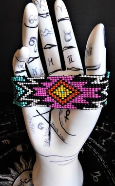 a hand that has some beads on it