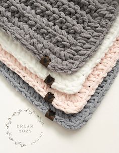 three crocheted blankets sitting on top of each other