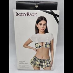 Whether You Want To Enjoy Some Erotic Roleplaying Or Spice Up Your Bedroom Look, This Four-Piece School Girl Lingerie Set Is The Perfect Intimate Attire! You'll Look Totally Stunning In This Sexy Lingerie Outfit, Including Revealing Bra Top, Shrug, Mini Skirt, And Matching G-String Panties. Exclusively At Spencer's Includes: Bra Top Shrug Mini Skirt G-String Panties Material: Polyester, Spandex Skirt Length: About 8" Hook Closure Care: Hand Wash Imported Arrives In Discreet Packaging Model Shown Lingerie Outfit, Lingerie Outfits, Yellow Plaid, Bra Top, Bra Tops, Skirt Length, Lingerie Set, Polyester Spandex, Mini Skirt