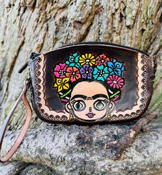 This wristlet wallet is a true masterpiece, a testament to the Artisan's skill and creativity. It's a one-of-a-kind piece that would make a statement with any outfit. It's a beautiful and unique piece!  Approximate measurements are  Widht 7 inches Height 5 inches  Depth 1 inch Eye Glasses Case, Wristlet Bag, Hand Tooled Leather, Tooled Leather, Wristlet Wallet, Leather Wristlet, Glasses Case, Leather Tooling, Eye Glasses