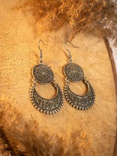 Pair of earrings handcrafted by talented artisans in the heart of Morocco. The traditional authenticity of these silver plated earring evoke the finesse of the orient. They are lightweight and comfortable to wear. ☀️ Exceptional Craftsmanship: Each pair is the result of meticulous work, showcasing the ancestral Moroccan craftsmanship. They are also unique pieces, bearing the imprint of the artisan who created them. The delicate patterns and finishes reflect the rich artistic heritage of Morocco. ☀️ Timeless Elegance: Their authentic design, inspired by oriental motifs and aesthetics, adds a touch of refinement to any outfit, from casual to sophisticated. ☀️ Gift Idea: Whether for yourself or a loved one, these earrings are an ideal choice to delight with original jewelry. By purchasing thi Bohemian Metal Jewelry For Festivals, Bohemian Oxidized Chandelier Earrings For Festivals, Bohemian Sterling Silver Chandelier Earrings For Festivals, Traditional Festival Chandelier Earrings With Intricate Design, Handmade Silver Vintage Chandelier Earrings, Festival Bohemian Metal Jewelry, Silver Brass Chandelier Earrings With Intricate Design, Vintage Silver Brass Chandelier Earrings, Bohemian Antique Silver Earrings With Intricate Design