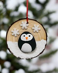 Experience the charm of winter with our unique Rock Penguin Ornament. Handcrafted from a single stone, it captures the playful spirit of these beloved creatures as they frolic in the snow. A must-have for any penguin lover's collection! The Rock Penguin ornament can only be purchased at 621 Creations. Penguin Christmas Ornaments, Bead Ornaments, Penguin Ornaments, Wood Slice Art, Handmade Christmas Crafts, Christmas Penguin, Beaded Ornaments