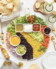 a platter filled with mexican food and condiments