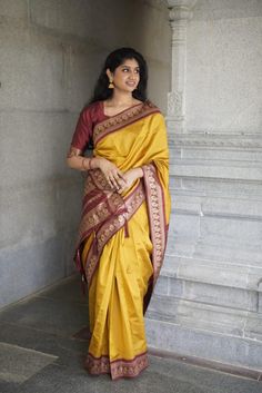 ✅ 𝐒𝐚𝐫𝐞𝐞: ✦ Mesmerizing Luxury Maroon Yellow Semi Silk Saree | 5.50 Meters in length ✦ Lightweight, non-transparent, and resilient ✦ Graceful portrayal of South Indian Fashion ✅ 𝐂𝐨𝐦𝐩𝐥𝐢𝐦𝐞𝐧𝐭𝐚𝐫𝐲 𝐀𝐝𝐝-𝐎𝐧𝐬: ✦ Complimentary Maroon Blouse Fabric Piece with Golden Lace (Length: 1.00 Meter) ✦ Free Fall and Edging (Pico) to ensure the ideal match! ✅ 𝐔𝐧𝐝𝐞𝐫𝐬𝐭𝐚𝐧𝐝𝐢𝐧𝐠 𝐒𝐚𝐫𝐞𝐞 𝐅𝐚𝐥𝐥𝐬: ✦ It's a cotton fabric piece sewn to the saree's inner edge for added support, structu Fitted Paithani Silk Saree For Wedding, Wedding Paithani Silk Dupatta, Navratri Blouse Piece With Tilla For Puja, Navratri Puja Blouse Piece With Tilla Details, Semi-stitched Saree With Tilla For Puja, Wedding Pre-draped Paithani Silk Saree With Cutdana, Anarkali Style Gold Saree With Tilla, Yellow Paithani Silk Lehenga For Wedding, Gold Paithani Silk Sets For Wedding