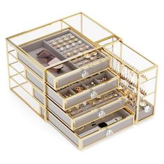 a set of drawers with jewelry in them