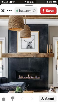 a living room with a fire place, couches and a dog on the floor