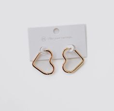 Add a touch of love to your ears with our Gold Open Heart Hoop Earrings! Waterproof and versatile, these earrings can be styled solo or stacked with other earrings for a playful look. Perfect for Mother's or Valentine's Day, these earrings make a great gift. Do good, be good. When you purchase this necklace, you are not only supporting a small business, but the type 1 diabetes community as well. A portion of all sales is donated back to non-profits like JDRF , T1 International, and American Diab Do Good Be Good, Heart Hoop Earrings, Open Heart, Type 1, Do Good, Of Love, Gold Earrings, Fun Things To Do, Valentine's Day