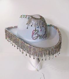 "Perfect for your bachelorette party or wedding, this rhinestone \"Bride\" cowboy hat will steal the show. Your choice of rhinestone finish atop a white felt cowboy hat (one size fits most, approx 22\" circumference. )  Ask me about group deals for your bridesmaids!  Please allow 1-2 weeks for processing, as every hat is made to order by myself ❤️ Each hat is 100% unique and may differ slightly from photos. If you would like to customize your hat send me a message to discuss ideas and pricing! W Fringe Cowgirl Hat, Bead Hangers, Bride Cowboy Hat, Embellished Cowboy Hat, Pink Cowboy Hat, Hat Diy, Cowgirl Accessories, Space Cowgirl, Country Music Festival