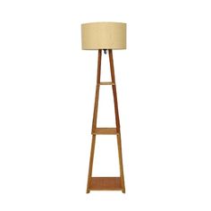 a wooden floor lamp with a beige shade on the top and bottom shelf below it