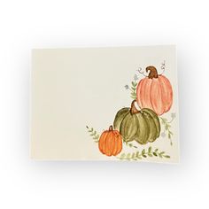 a card with pumpkins and leaves on it