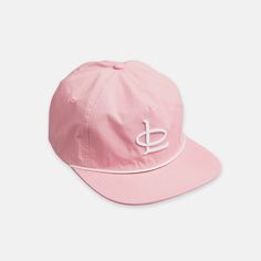 a pink hat with white embroidery on the front