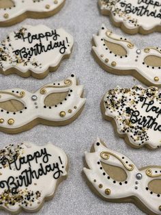 decorated cookies with happy birthday written on them and masks for masqueraders to decorate