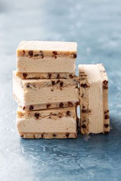 four pieces of ice cream stacked on top of each other with chocolate chips in the middle