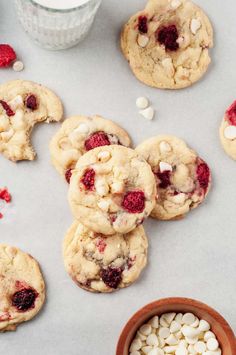 A batch of chewy white chocolate raspberry cookies on parchment paper, surrounded by fresh raspberries and white chocolate chips. White Chocolate Raspberry Cookies, Chocolate Raspberry Cookies, Raspberry Cookie Recipes, Cranberry Cookies Recipes, Peanut Butter Kiss Cookies, Oatmeal Cranberry Cookies, Raspberry Desserts, Holiday Desserts Table, Raspberry Cookies