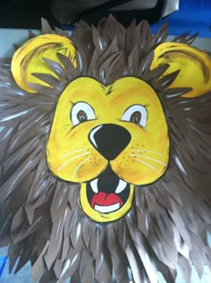 a paper mache of a lion with its mouth open