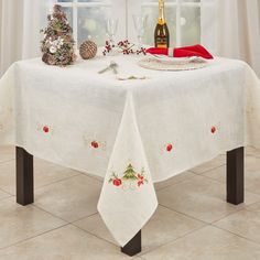 a white table cloth with christmas decorations on it