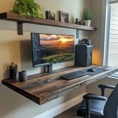 a computer monitor sitting on top of a wooden desk