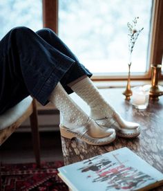 "Step into the enchantment of the holiday season with our timeless Metallic Silver Tokyo Clog Mules. Meticulously crafted for both quality and comfort, these low-heeled classics feature a captivating Metallic Silver hue reminiscent of glistening winter moonlight. The light wooden base complements the sleek leather, creating an elegant silhouette that effortlessly captures the essence of refined style. Step confidently into the spotlight with our Tokyo Metallic Silver Clog Mules - a fusion of tim Winter Clogs With Wooden Heel And Round Toe, White Round Toe Clogs For Winter, Winter Closed Toe Clogs With Leather Sole, Clogs Outfit Winter, Sandgrens Clogs, Leather Types, Platform Clogs Shoes, Mules Women, Clogs Outfit