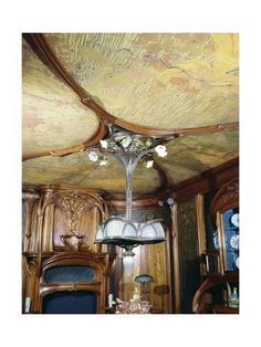 the ceiling is covered in wood and has an ornate chandelier