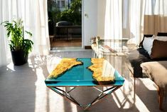 a living room filled with furniture and a blue table