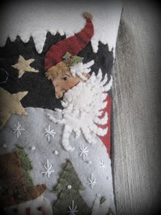 a christmas stocking hanging on the side of a wall