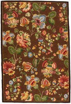 a brown rug with flowers and leaves on it