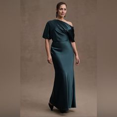 Amsale Pryce Off-Shoulder Satin Column Gown Emerald Green New With Tags Size 8 From Bhldn Anthropologie, Retail: $495 “Silky And Off-The-Shoulder, The Amsale Pryce Satin Column Gown Evokes Elegance And Simplicity While Ensuring Easy Movement. The Asymmetrical Draped Neckline Falls To Sleeves That Gently Land At The Elbow, Offering An Ideal Amount Of Coverage. Fitted At The Waist And Hips And Cascading Down To The Floor, This Gown Makes A Stunning Option For Mothers Of The Bride Or Groom.” Polyes Mother Of Groom Dresses, Mob Dresses, Wedding Top, Column Gown, Column Dress, Black Tie Wedding, Satin Maxi Dress, Little White Dresses, Groom Dress