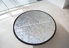 a round glass table with the words sams - art and crafts written on it