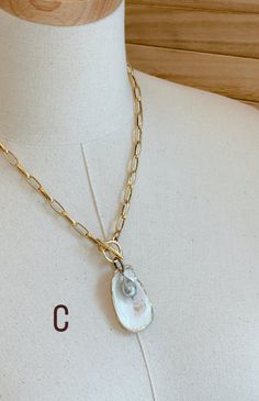 A one-of-a-kind statement piece. Hand painted gold leaf natural oyster shell pendants with gorgeous freshwater pearls, on high quality 12K Gold over brass chain with toggle front closures. Each shell has been harvested in our Charleston, SC rivers and are carefully hand finished to create its one-of-a-kind appearance. No two shells are alike. Each oyster shell as its own story behind its journey to the shore. The size, shape and colors in each one will vary and that is what makes each shell trul Gold Abalone Shell Necklace In Unique Style, Unique Gold Abalone Shell Necklaces, Unique Gold Abalone Shell Necklace, Unique Gold Jewelry With Abalone Shell, Gold Necklace With Pearl Charm, Unique Gold Necklace With Abalone Shell, Unique Gold Necklace With Pearl Charm, Gold Shell Necklace With Baroque Pearl Pendant, Elegant Gold Necklace With Abalone Shell