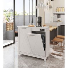 a kitchen with a white cabinet and counter top