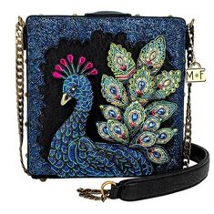 "Mary Frances Show Off your Colors Crossbody Handbag New With Tags This beautiful display of three-dimensional beading is sure to impress with this Mary Frances bag! Each peacock feather is sculpted by artisans using a mix of beads and metallic thread to help you show off your colors. With a magnetic flap closure for easy access, you'll feel secure storing your essentials away inside. This bag features a non-removable padded chain strap for comfort and bottom feet to keep your bag clean and dama Mary Frances Bags, Mary Frances Handbags, Novelty Handbags, Handbag Storage, Mary Frances, Pocket Handbag, Novelty Bags, Beaded Handbag, Peacock Feather