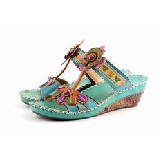 If you loved the vibrant color and genuine leather. These hand-crafted shoes are made with all the features you know and love, like the supreme vibrant color, the ultra-comfortable calfskin, exquisitely designed with eye-catching hand-embossed & hand-painted flowers, and details. Are you ready to be the center of a Green Leather Wedge Sandals For Beach, Green Leather Wedge Sandals For Vacation, Bohemian Leather Wedge Sandals For Spring, Green Leather Closed Toe Wedge Sandals, Multicolor Leather Wedge Sandals For Summer, Green Leather Toe Post Sandals, Artisan Leather Sandals For Spring, Green Leather Bohemian Sandals, Green Bohemian Leather Sandals