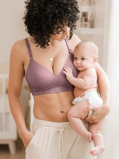 Bye-bye, bunched padding. The comfy, contemporary Contour Bra is the fixed padding nursing T-shirt bra you’ve been searching for, providing effortless contouring and comfort from pregnancy to postpartum. Molded cups that define, separate, and shape Stretchy but supportive wireless construction Nursing clips for convenient feeding and skin-to-skin Low-cut neckline and “ballet” style back Hook-and-eye back closure Elegant Push-up Nursing Bra, Soft Touch Fitted Low-cut Nursing Bra, Fitted Low-cut Nursing Bra With Soft Touch, Low-cut Padded Nursing Bra, Soft-touch No-show Nursing Bra, Nursing Sports Bra, Graphic Onesies, Nursing Tank, Ballet Style