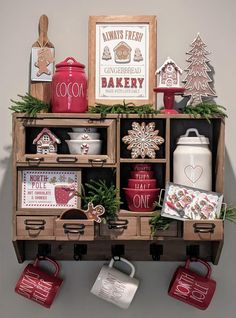 an assortment of christmas items on display in a wooden crate with tags and magnets