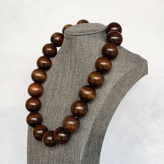 Wood Bead Necklace, Chunky Wood Necklace, Wooden Necklace, Brown Beaded Necklace, Unisex Necklace, Mens Wood Necklace, Mens Boho Necklace This unisex necklace was hand beaded using large 25mm round brown wooden beads. It measures approximately 20 inches long and is securely fastened with a silver clasp. The end result is a classic piece that fits in perfectly with today's fashion trends! Want a different length? Just ask! Check out the matching earrings: https://www.etsy.com/listing/541287677/wo Festival Fits, Large Bead Necklace, Brown Beaded Necklace, Wooden Bead Necklaces, Necklace Mens, Wood Bead Necklace, Stone Wrapping, Necklace Chunky, Wooden Necklace