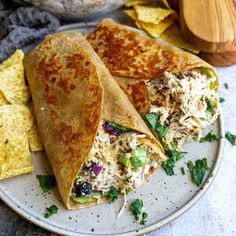 chicken salad wraps on a plate with tortilla chips