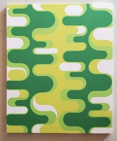 a green and yellow abstract painting on a wall