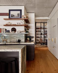 the kitchen is clean and ready to be used as a dining room or office space