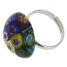 This artistic hand-made Murano glass ring is created by highly skilled Murano artisans using famous centuries-old Millefiori technique. This fun and trendy accessory featuring stylized multi-colored flowers will add a touch of authentic Venetian style to any outfit. The Murano ring's central bead measures 3/4 inches in diameter and the band is silver-plated and adjustable to fit any finger size. The ring comes with an attractive velvet pouch and a certificate of authenticity. Because each item i Mosaic Ring, Italian Leather Handbags, Murano Glass Jewelry, Multi Colored Flowers, Italian Bags, Glass Christmas Tree Ornaments, Glass Ring, Handmade Handbags, Christmas Figurines