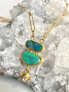 "Opal, Diamond, 22k Gold Handmade Chain Necklace Luscious, teal, aqua and various shades of blue beam in this double Australian Boulder Opal necklace. They are wrapped in solid 22k Gold including my 22k Gold handmade chain.  The Opals are the focal point of this gorgeous, one of a kind \"statement\" necklace that looks beautiful at any angle as shown in the photos taken in natural light. A Diamond dangler adds harmony and a touch of elegance to this stunning necklace. It caresses the neck effortlessly at 18\" long. Free insured shipping with signature confirmation." 22k Gold Chain, Gold Chain Pendant, Boulder Opal Necklace, Interlocking Circle Necklace, Blue Opal Necklace, Mixed Metal Earrings, Handmade Chain, Gold Chain With Pendant, Jewelry Outfit