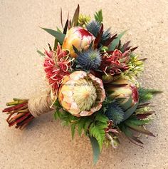 a bouquet of flowers is laying on the ground