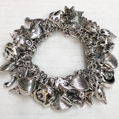 Tons Of Charms. Sea Shells, Starfish, Seahorses And Conch Shells. Silver Tone Stretch Bracelet. Harry Potter Charm Bracelet, Girly Bracelets, Conch Shells, Lotus Bracelet, Crystal Cuff Bracelet, Jeweled Earrings, Seahorses, Silver Charm Bracelet, Birthstone Bracelets