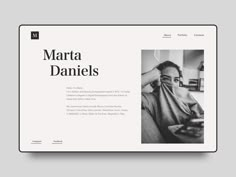 the website design for marta daniels is displayed on a tabletop, with an image of a woman covering her face