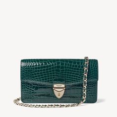 Mayfair Clutch 2 in Evergreen Patent Croc | Aspinal of London Luxury Formal Bags With Palladium Hardware, Elegant Leather Clutch With Palladium Hardware, Formal Rectangular Clutch With Palladium Hardware, Elegant Formal Shoulder Bag With Palladium Hardware, Classic Rectangular Clutch With Palladium Hardware, Classic Clutch With Palladium Hardware, Luxury Green Evening Bag With Dust Bag, Luxury Green Shoulder Bag For Evening, Classic Evening Clutch With Palladium Hardware