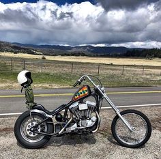 a motorcycle is parked on the side of the road