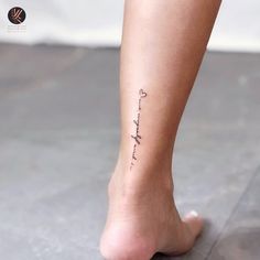 a woman's foot with a tattoo on it that says, i love you