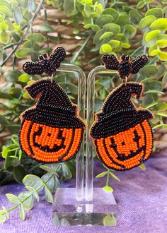 the beaded pumpkin earrings are on display