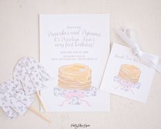 a card with some cake on it next to other items